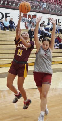 Clinton’s AJ Spottedwolf lays the ball up over a defender during the JV road game Monday against Weatherford. CDN | Sam Goodwyn