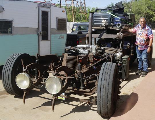Jim Clark, of Debuke, Iowa, stops in Clinton to refill his vehicle Tuesday. The vehicle has the body of a 1929 Ford Model A as the cab, and a 78-passenger school bus engine attached to the front. The trip is to travel Route 66 from Goodsprings, Nev., to Langley, Ill., for “Rat Stock.” CDN | Christian Jacobsen
