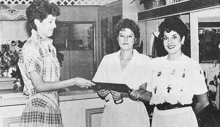40 YEARS AGO From left, Chamber of Commerce president Kay Smith, presented a membership certificate to Paula Simon and Nancy Dowdell, owners of Children’s Chatter.