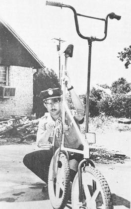 40 YEARS AGO Patrolman Mark Lumpkin tuned up his high rise bike to get it ready to ride in the Rotary Rodeo Parade.