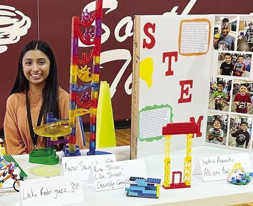 Joanna Venegas shows off several student STEM-based projects to better convey the value in the Clinton Public School’s REDS 365 program to community members at Southwest Elementary. CDN | Courtesy photo