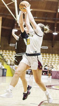 No. 21 Rhylee Rodebush fights with an Elk City defender for the ball during Clinton’s home game against the Elkettes. CDN | Sam Goodwyn