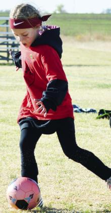No. 12 Yami Flores looks to make a pass to her fellow teammates