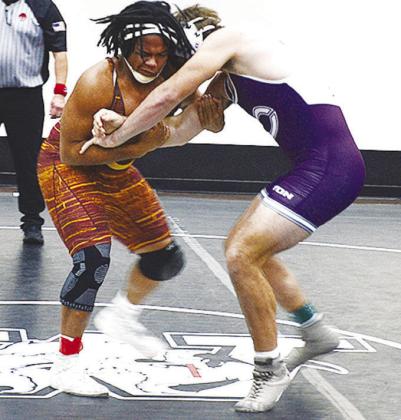 Clinton’s Malachi Lorne, left, grapples with his opponent during the first day of the Max Dipple Memorial Wrestling Tournament in Weatherford over the weekend. CDN | Sam Goodwyn