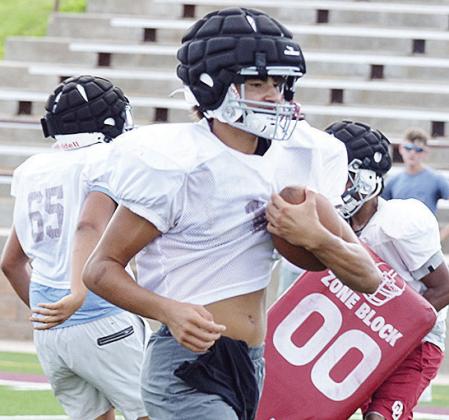 JJ Ruiz carries the ball during a drill during practice in the Tornado Bowl. CDN | Sam Goodwyn