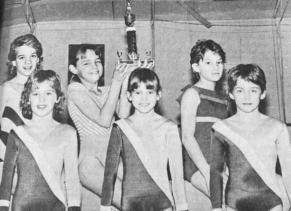 40 YEARS AGO Members of the Olympic Gold team, competiton team represented Western Oklahoma Gymnastics, Inc. of Clinton, brought home the third-place team trophy. Shown with the award were, front from left, Misti Bunch, Paige Lindley and Amy Powell; back,