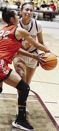 Senior Lillian Lime battles a Lindsay player in Clinton’s recent game against the Leopardettes in the Tornado Dome. CDN | Sam Goodwyn