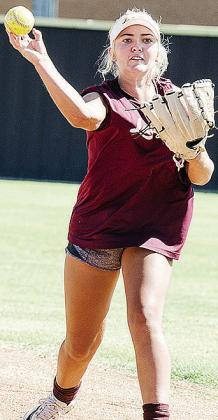 Laney Anderson hurls the ball to her partner during the warm-up exercise prior to Clinton’s preseason practice. CDN | Sam Goodwyn