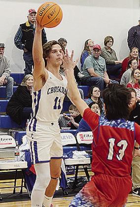 No. 11 Braxton Souza throws the ball over a defender to an open teammate during CBA’s game against the Trojans. CDN | Sam Goodwyn