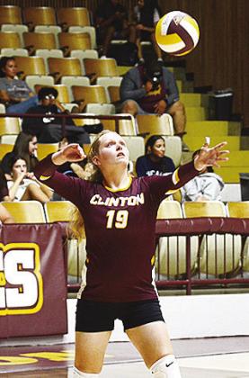 Clinton’s Sammie Hammond serves the ball during the Lady Reds’ match against Cache Thursday. CDN | Sam Goodwyn