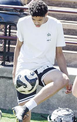 Recent grad Kyron Forrest juggles the soccer ball to warm up prior to practice in the Tornado Bowl. CDN | Sam Goodwyn