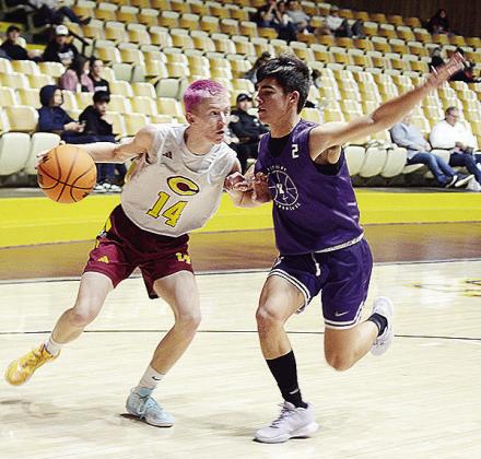 Ryder Adams drives against a Bethany defender on his way to the basket during the Clinton’s boys’ JV home game against the Bronchos. CDN | Sam Goodwyn