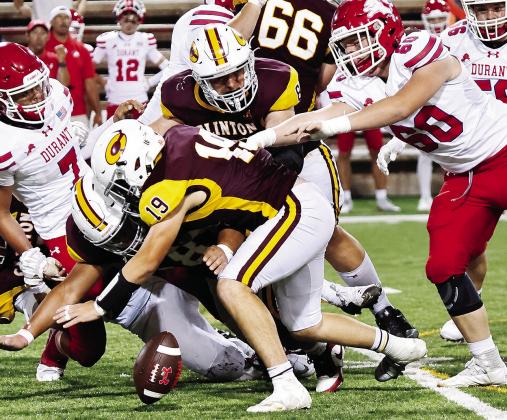 Clinton’s No. 19 Dyson Moss leads a trio of defenders as the Red Tornadoes attempt to jump on the loose ball during Clinton’s win over Durant in the Tornado Bowl. CDN | John Kinsey