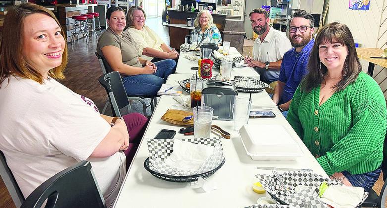 From left, Melissa Knabe, President-Elect Haley Adams, Allyson Adams, Jill Weedon, President Billy Smith, Justin Tharp, and Secretary Ashley Underwood enjoy a meal at Split Decision every Thursday during their regular Kiwanis meeting. CDN | Shiann Dawson