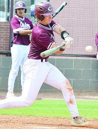 Clinton’s Vince Jones swings at the ball during the Reds’ home game Wednesday against the Bethany Bronchos. CDN | Sam Goodwyn