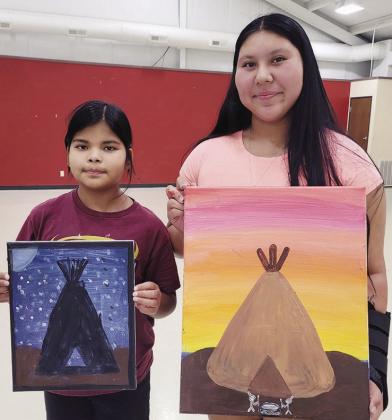 Eternity Frank, left, and Marly Gamboa show off paintings they did during the Native Country Creative Arts paint party at the Cheyenne and Arapaho ERC Building on Dog Patch Road. CDN | Courtesy photo