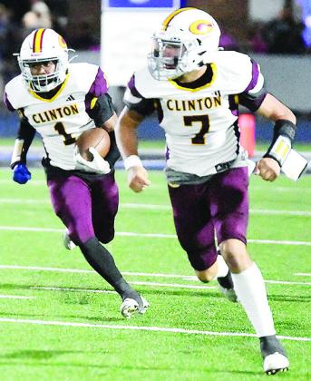 No. 7 Easten Powell leads No. 1 Derren Hester down the field as he carries the ball in Clinton’s road game Friday against Bridge Creek. CDN | John Kinsey