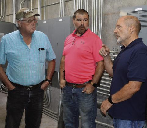 From left, Dist. 3 Commissioner Lyle Miller, Maj. Jeff Maynard, and Dist. 2 Commissioner Bruce Walker discuss the new security system at the Custer County Jail in the server room. CDN | Shiann Dawson