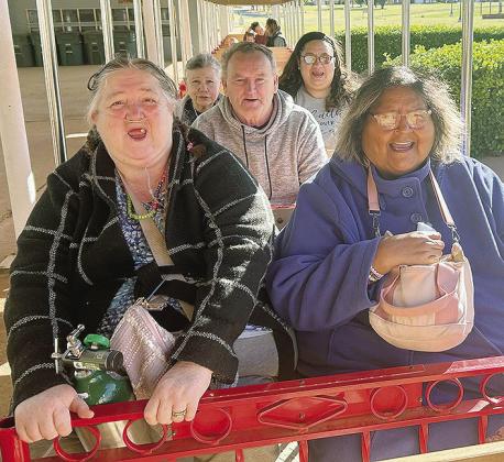 Front left, Virginia Caler, Wilma Whitehorse; middle, Jimmy Terrell; back, Paulyn West, and Martha Zomara take a ride on the Centennial Train as it passes through Acme Brick Park. CDN | Courtesy photo