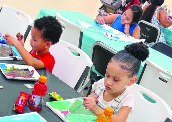 Saint Farrow, left, Hazel Farrow, and Bravery Nowlin, back, paint teepees during the Native Country Creative Arts paint party at the Cheyenne and Arapaho ERC building on Dog Patch Road. CDN | Courtesy photo
