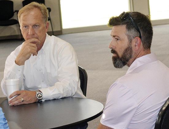 Kevin Hern, left, discusses local politics and ideas with Clinton community members such as Fayne Sawatzky Friday at the Frisco Center. CDN | Christian Jacobsen