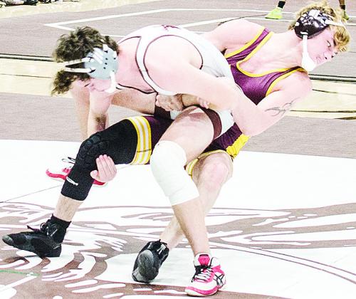 Landon Wilson, right, throws his oppnent to the mat during Clinton’s District Dual against the Elks in Elk City. CDN | Sam Goodwyn