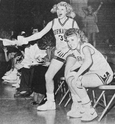 40 YEARS AGO Judith Kirkpatrick led cheers from the bench as the Lady Tornadoes rallied in the closing moments of the game against Cordell. Tonya Meyer was at right.