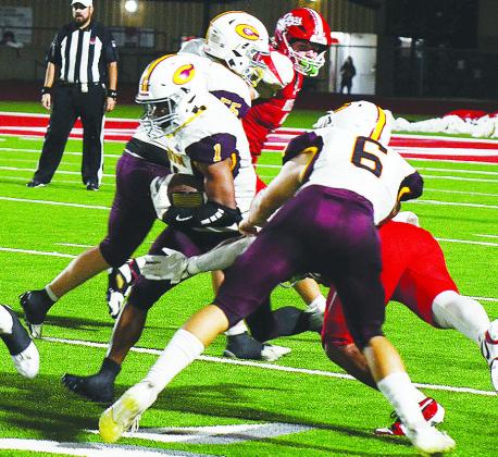 Clinton’s No. 6 Benton Bridgeman and No. 55 Bryson Snider provide key blocks for No. 1 Derren Hester as he carries the ball up the field during the Red Tornadoes’ road game Thursday against Cache. CDN | Micah Ashcraft