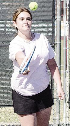 Clinton’s Vanessa Schmitz hits the tennis ball during tennis practice at the high school courts. CDN | Sam Goodwyn