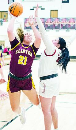Clinton’s Rhylee Rodebush fights against a defender for the layup during the Lady Reds’ Class 4A district championship Saturday in Weatherford. CDN | Sam Goodwyn