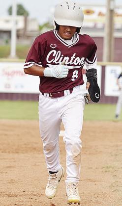 Clinton’s Azreal Fierros hustles to third during the Reds’ home game against Kingfisher. CDN | Sam Goodwyn