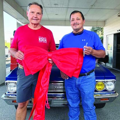 Rick Koch, left, awards Freddie Cardenas the keys to a 1966 Chevy Chevelle at Lucille’s Roadhouse. CDN | Courtesy photo