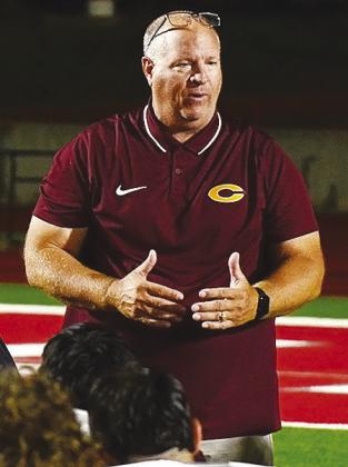 Clinton coach John Higbee speaks with his team following the Red Tornadoes’ 48-45 double overtime loss at Cache. CDN | Micah Ashcraft