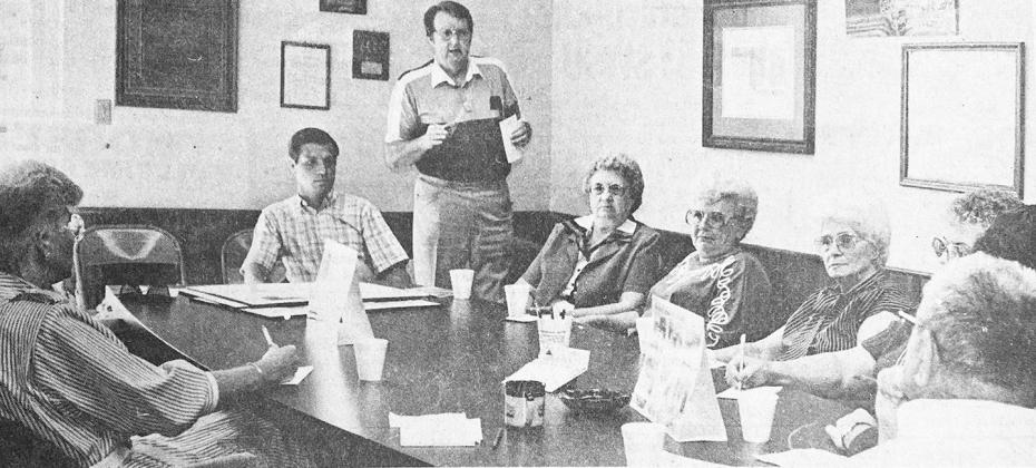 40 YEARS AGO Bill Robinson, standing, discussed the Street Scape project with, from left, Jane Ernst, Skip Heard, Beryl Kelley, Marian Meeks, Carmen Smith, Jean Wohl, Dennis Hill and Bill Kelley at a Clinton Chamber of Commerce planning session.