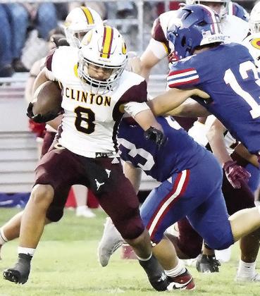 Clinton’s Jaden Potter avoids a Chandler defender during the Red Tornadoes’ road game Friday against the Lions. CDN | John Kinsey