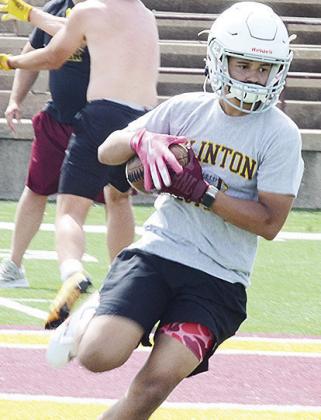 Clinton’s Jaden Potter catches the ball and turns up field during a spring practice in the Tornado Bowl. CDN | Sam Goodwyn