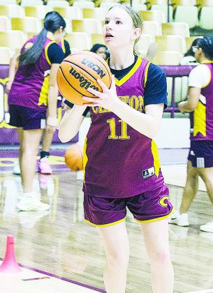 Hannah Miller focuses on the basket as she prepares to shoot the ball during a drill in practice. CDN |Sam Goodwyn