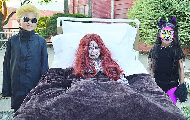 In the 7-year-old category, from left, Spencor Dudek, son of Nichole Rushing, won second place as Gojo, Aislynn Casas, daughter of Wally and Nancy Casas, won first place as The Exorcist, and Adelynn Marquez, daughter of Claudia and Ray Marquez, won third