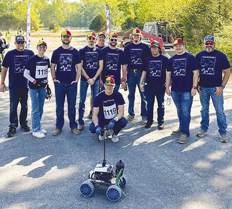 The SWOSU Rover Dawgs with the remote-controlled rover. From left are Brett Chase, Tiffany Lorenz, Wyatt Riley, Ryker Miller, Brandon Ogle, Wyatt Chisum, Kaleb DeVaughan, Brian Izaguirre, Jonathan Wilson, and Nathan Brooks.