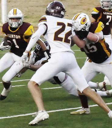 Clinton’s No. 15 Gavin Evans provides a block while No. 1 JJ Ruiz tries to find a hole during the Red Tornadoes’ win over the Lions. CDN | John Kinsey
