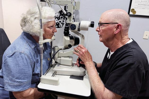 Suzanne Day, left, gets one last eye exam from her husband, Dr. Pat Day. CDN | Shiann Dawson