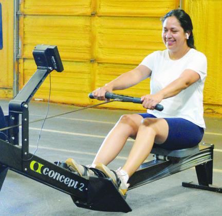 Annabell Rojas works on her set of seated cable rows at the Acme Brick Park gym. CDN | Christian Jacobsen