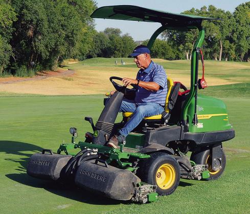 Kent Miller mows the greens and course of hole No. 17 Thursday at Riverside Golf Course. CDN | Christian Jacobsen