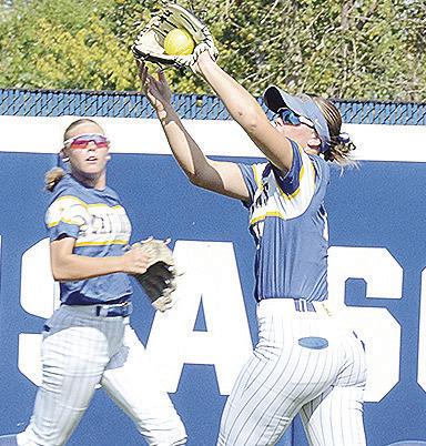A-B’s Peyton Lambeth, right, makes a running catch for the out while Dalaynie Lee backs her up during the Lady Indians’ state championship win over Caddo Saturday at Devon Park. CDN | Sam Goodwyn
