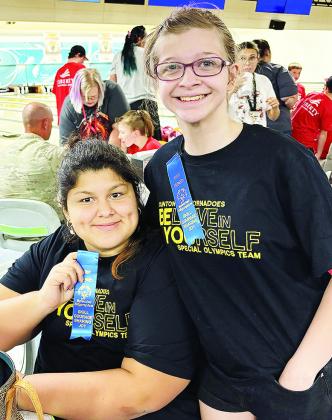 Winter Lee, left, and Raylei Harrell show off their first-place ribbons, after representing the Clinton Red Tornado Special Olympics Team at a regional bowling contest in Lawton. CDN | Courtesy photo