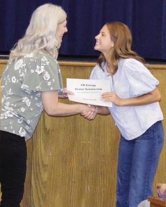 School Counselor Kristen Hill, left, awards the CK Energy Senior Scholarship to Lillian Roush during the Senior Awards ceremony at the A-B auditorium.