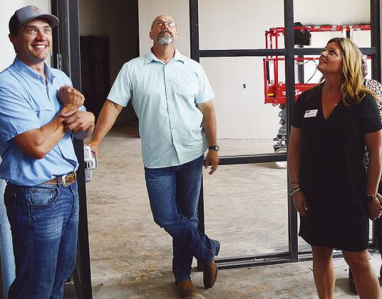 From left, Project Manager Justin Becker gives new Superintendent Nathan Meget and Clinton Board of Education President Kim Meacham a tour of the new Clinton Middle School building after Monday’s board meeting. CDN | Micah Ashcraft