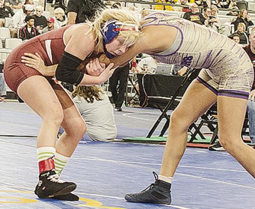 Clinton’s Baylor Moore, left, grapples with her opponent during the consolation semifinals of the Class 5A girls’ wrestling tournament Saturday morning at OG&amp;E Coliseum in Oklahoma City. CDN | Sam Goodwyn