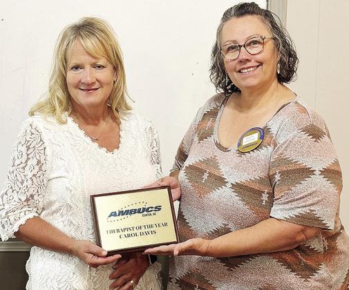 Carol Davis, left, and Misty Crider pose together after Davis receives a plaque for the Ambucs Therapist of the Year Award. CDN | Courtesy photo