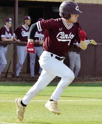 Clinton’s Chase Ray hustles to first during the Reds’ home game against Woodward. CDN | Sam Goodwyn